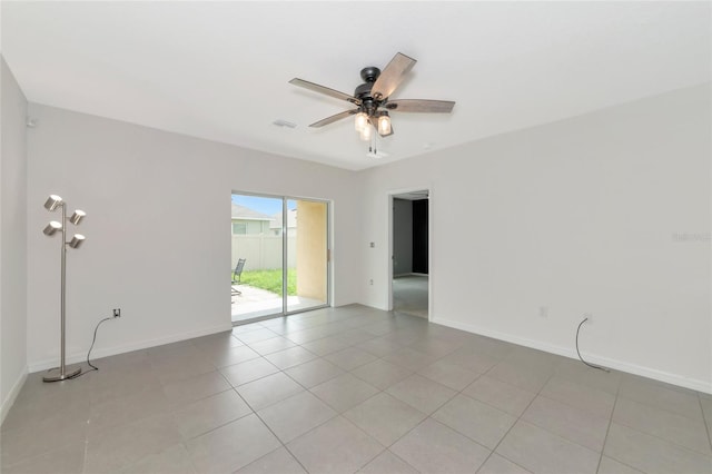 unfurnished room featuring ceiling fan and light tile patterned floors