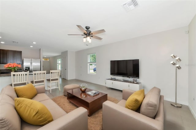 living room featuring ceiling fan