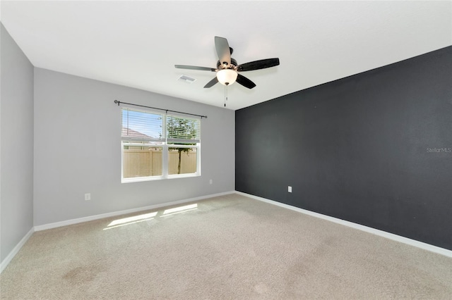 carpeted empty room with ceiling fan