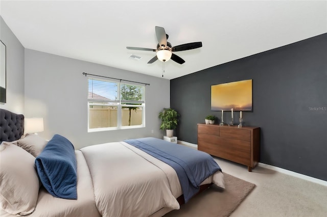 bedroom with light carpet and ceiling fan