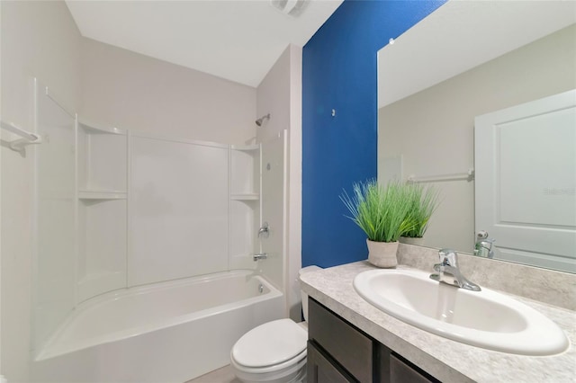 full bathroom featuring vanity, bathing tub / shower combination, and toilet