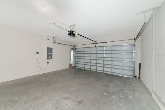 garage featuring a garage door opener and electric panel