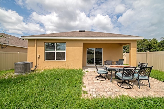 back of house featuring a patio and central air condition unit