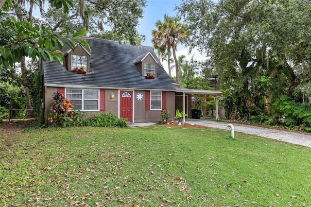 view of front of house with a front lawn and a carport