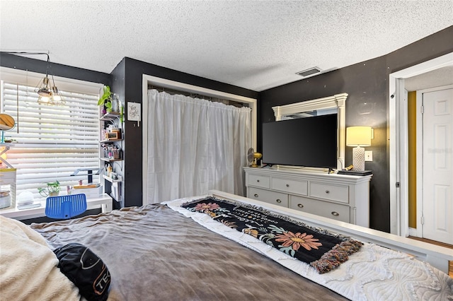 bedroom with a textured ceiling