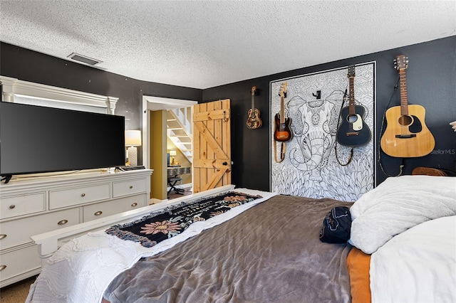 bedroom featuring a textured ceiling