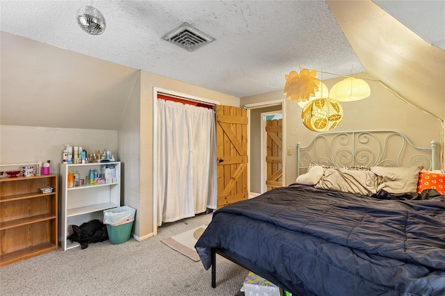 bedroom featuring carpet floors, a textured ceiling, and vaulted ceiling