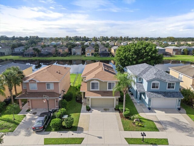 birds eye view of property featuring a water view