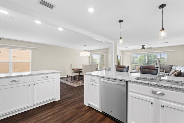 kitchen featuring dark wood-type flooring, white cabinets, dishwasher, ceiling fan, and sink