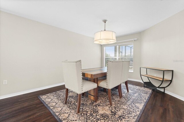 dining space featuring dark hardwood / wood-style floors