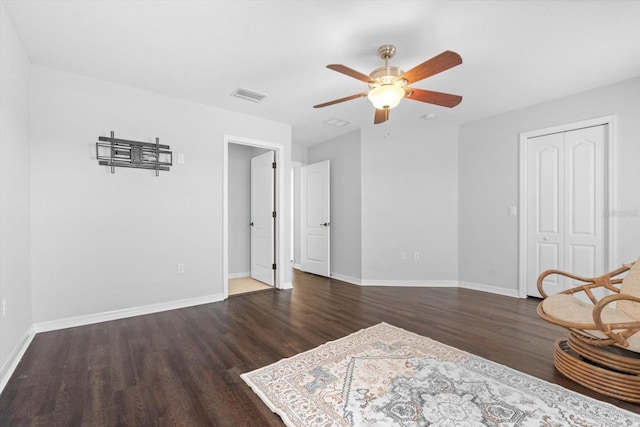 unfurnished room featuring ceiling fan and dark hardwood / wood-style floors