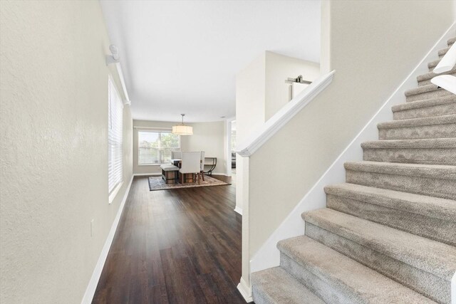 stairs with wood-type flooring