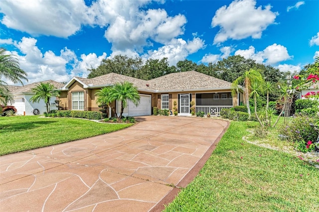 ranch-style house featuring a front lawn and a garage