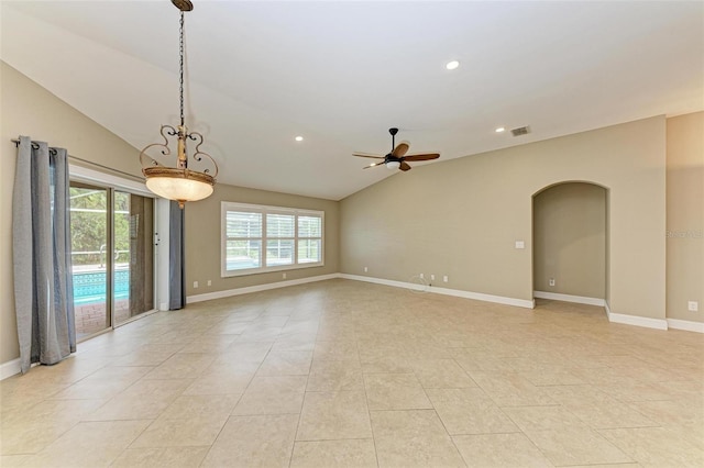 tiled empty room featuring ceiling fan and lofted ceiling