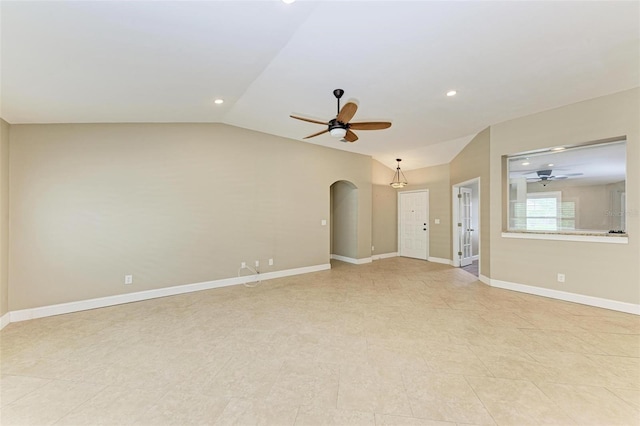 unfurnished living room with ceiling fan and lofted ceiling