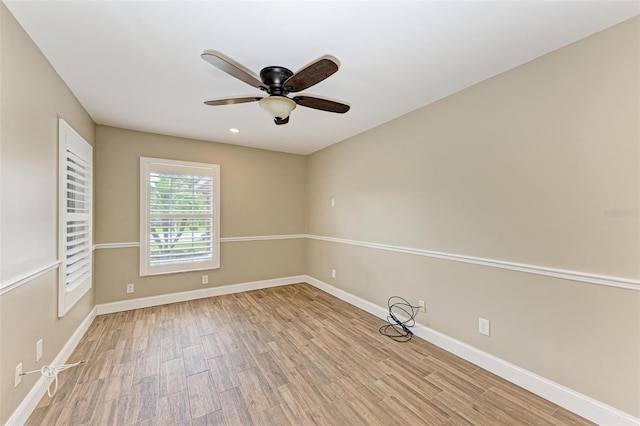 empty room featuring ceiling fan and light wood-type flooring