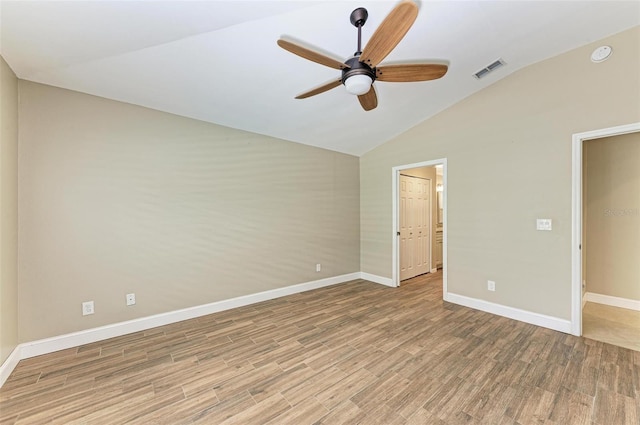 unfurnished bedroom with hardwood / wood-style floors, vaulted ceiling, and ceiling fan