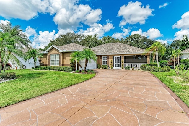 single story home featuring a garage and a front lawn