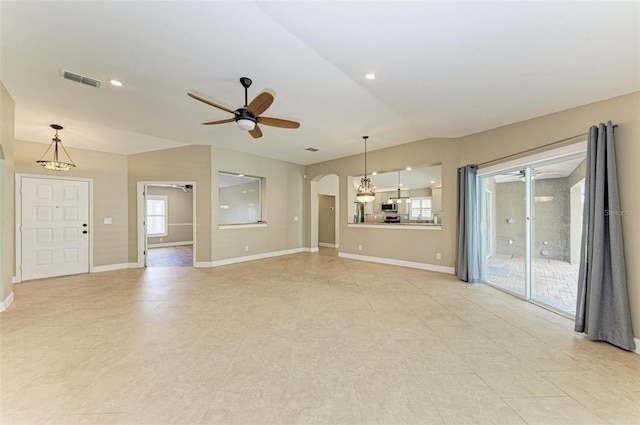 unfurnished living room with ceiling fan