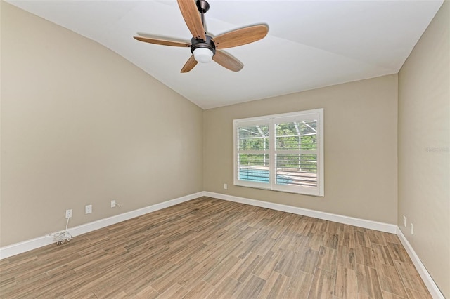 unfurnished room with light hardwood / wood-style floors, ceiling fan, and lofted ceiling