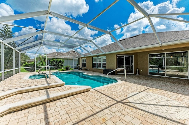 view of pool with a lanai, a patio, and a hot tub