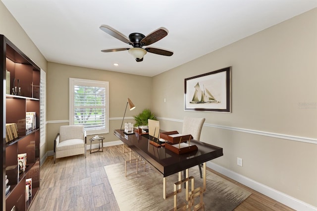 office featuring hardwood / wood-style floors and ceiling fan