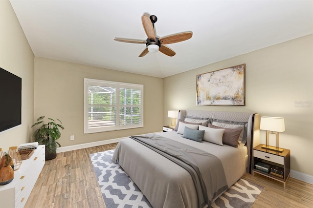 bedroom featuring ceiling fan and light hardwood / wood-style floors