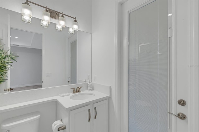 bathroom with toilet and vanity