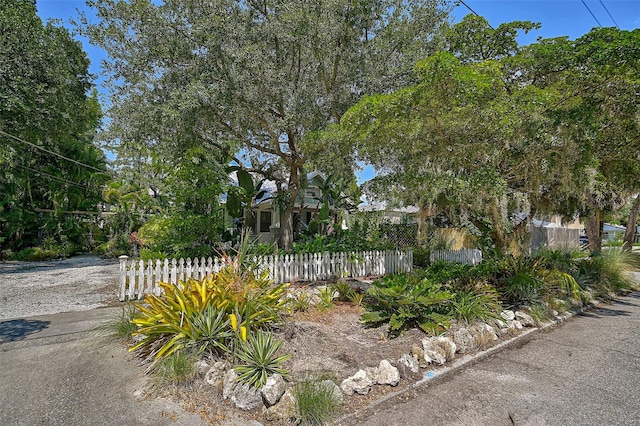 1677 4th St, Sarasota, FL 34236 - view of property hidden behind natural elements featuring a fenced front yard