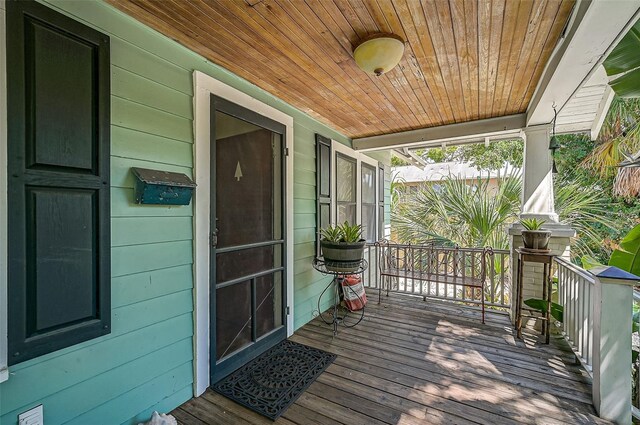1677 4th St, Sarasota, FL 34236 - wooden terrace with a porch