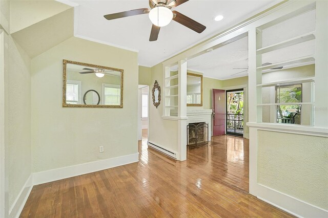 1677 4th St, Sarasota, FL 34236 - spare room featuring baseboard heating, wood-type flooring, and a ceiling fan