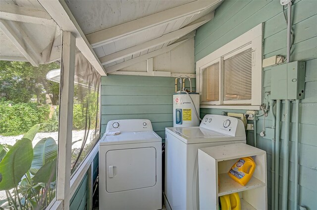 1677 4th St, Sarasota, FL 34236 - laundry area featuring laundry area, washing machine and clothes dryer, wooden walls, and water heater