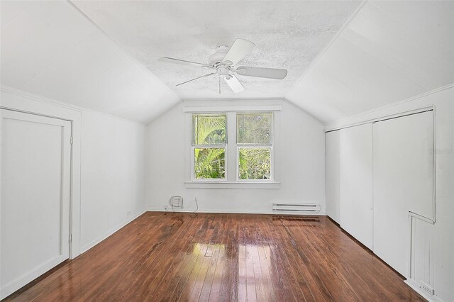 1677 4th St, Sarasota, FL 34236 - bonus room with a baseboard heating unit, a ceiling fan, a textured ceiling, hardwood / wood-style floors, and lofted ceiling