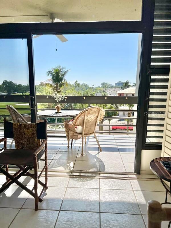 sunroom / solarium featuring tile patterned flooring