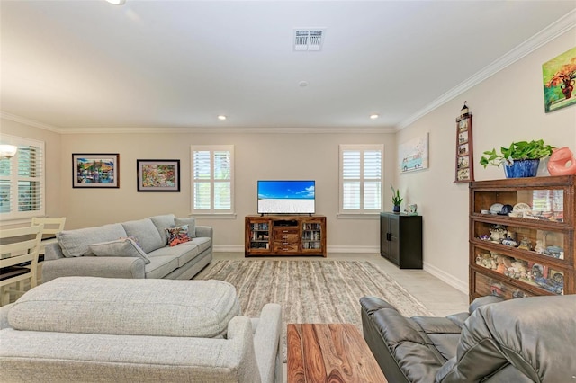 carpeted living room featuring ornamental molding and a wealth of natural light