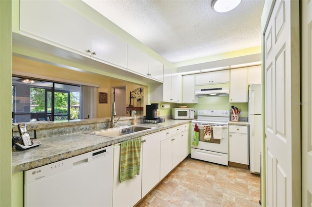 kitchen featuring a textured ceiling, sink, white appliances, and white cabinetry