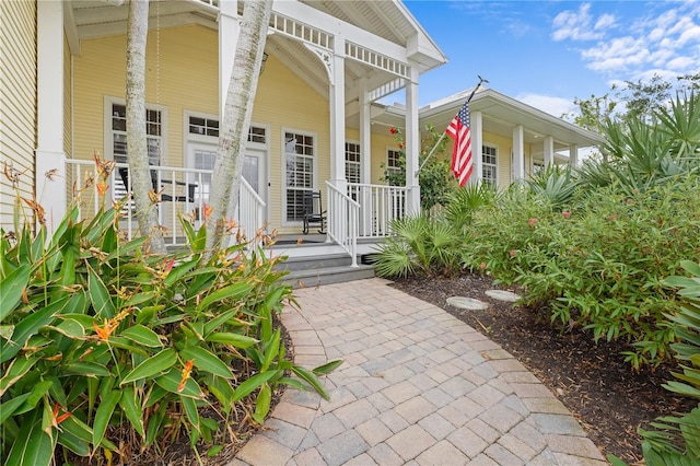 property entrance with covered porch