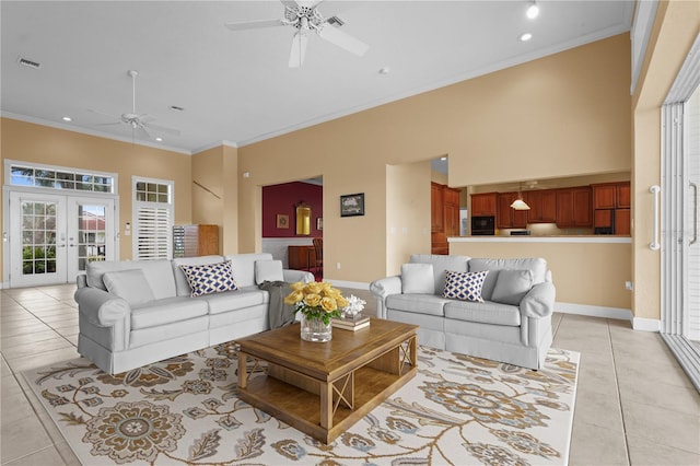 living room featuring french doors, ornamental molding, and light tile patterned floors