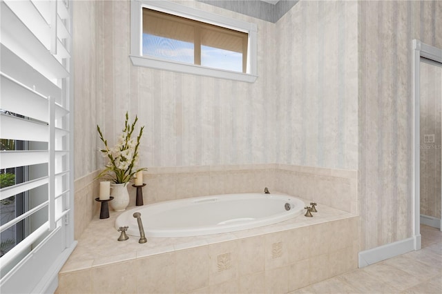 bathroom with built in features, tile patterned flooring, and a relaxing tiled tub