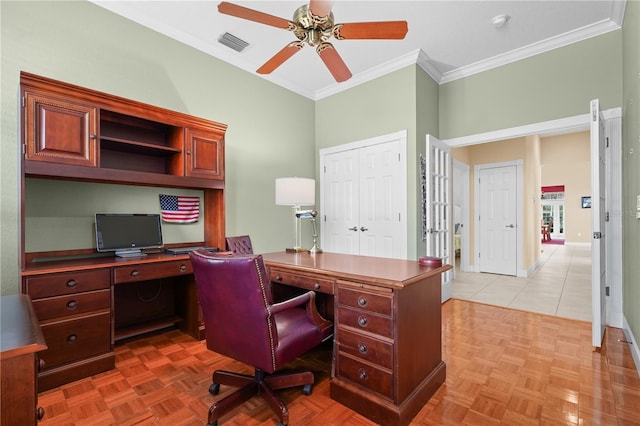 office space featuring light parquet floors, ceiling fan, and ornamental molding