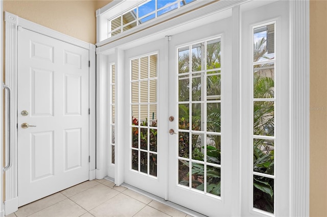 doorway with light tile patterned floors