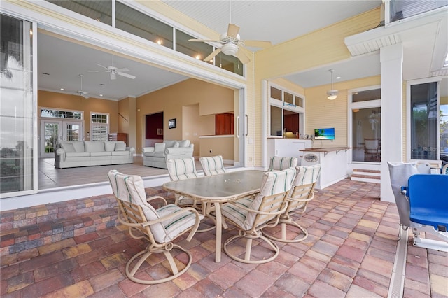 interior space featuring an outdoor living space and ceiling fan