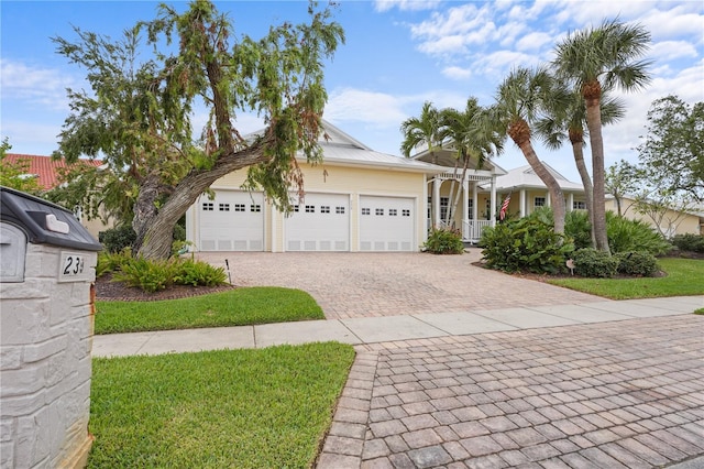 view of front of house featuring decorative driveway and an attached garage