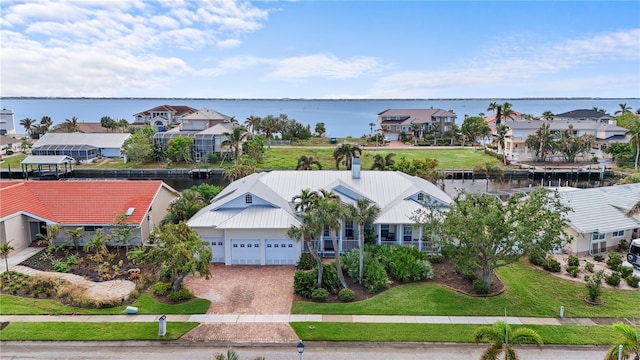 bird's eye view featuring a residential view and a water view