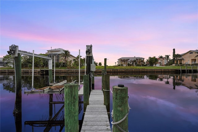 view of dock featuring a water view and boat lift