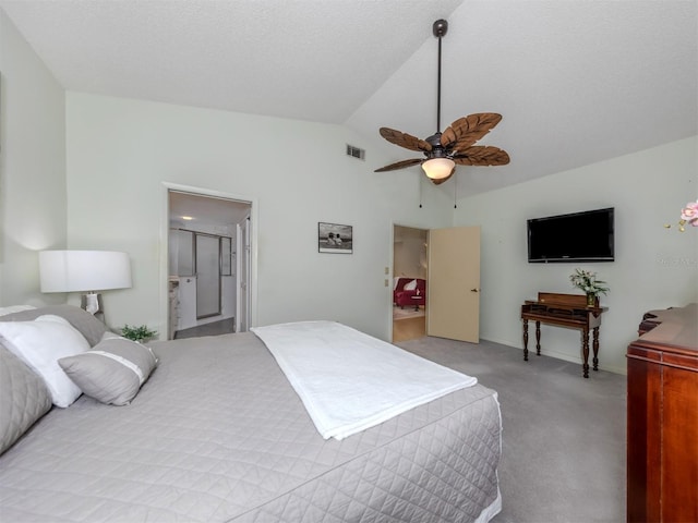 carpeted bedroom featuring ceiling fan, connected bathroom, and lofted ceiling