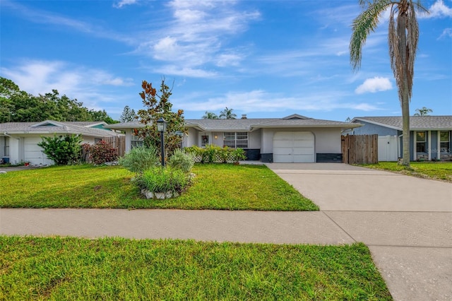 ranch-style home with a front lawn and a garage