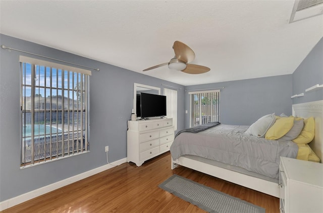 bedroom featuring wood-type flooring and ceiling fan