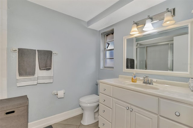 bathroom with tile patterned floors, a shower with door, vanity, and toilet