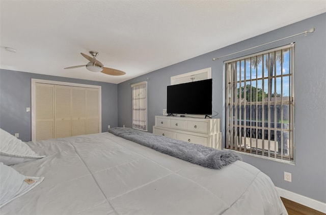 bedroom featuring a closet, ceiling fan, and wood-type flooring